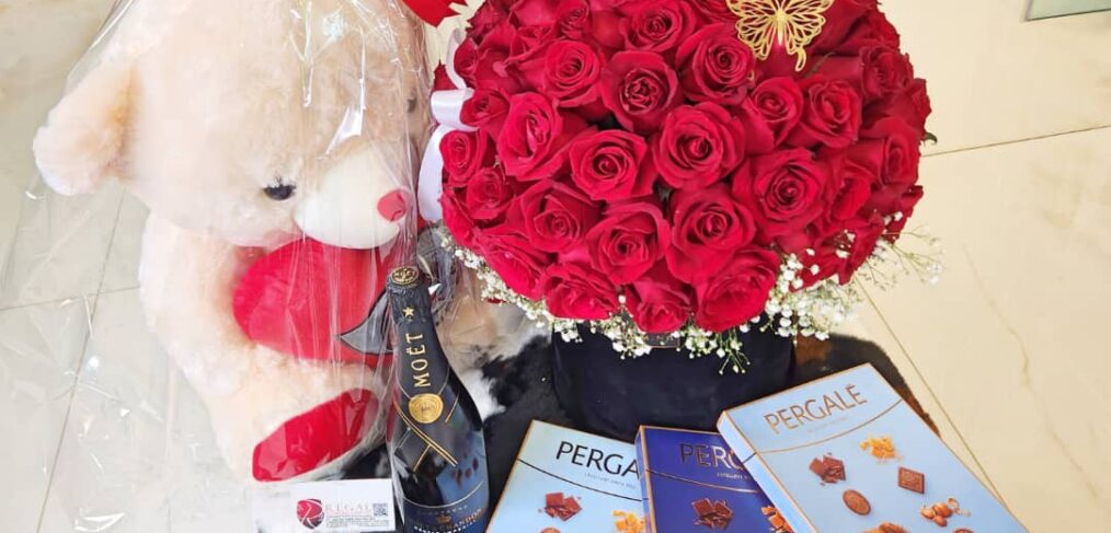 Red roses bouquet chocolates teddy bears and moet champagne