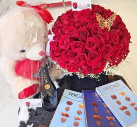 Red roses bouquet chocolates teddy bears and moet champagne