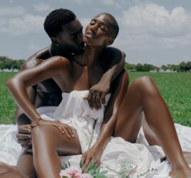 black couples on a semi nude data with flowers