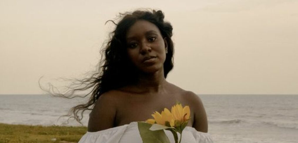 Beautiful lady and her beautiful sunflower