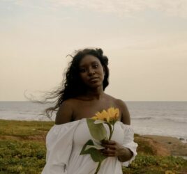 Beautiful lady and her beautiful sunflower