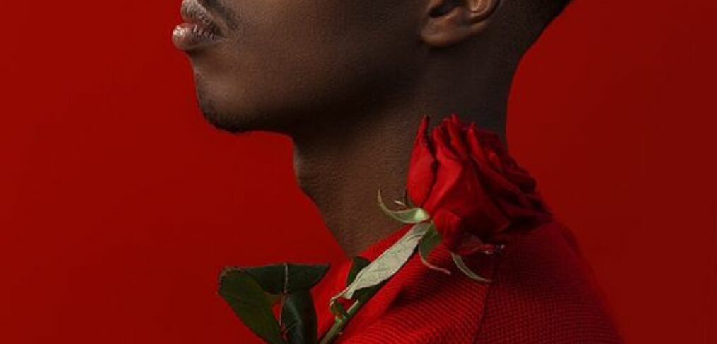 man in red with red roses