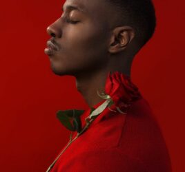 man in red with red roses